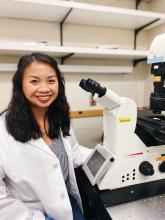 sitting at confocal microscope